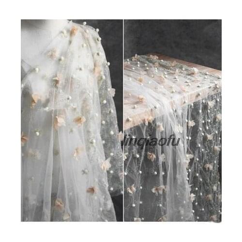 Three-dimensional white ball Jin Tianluo flowers hand-embroidered perspective mesh yarn dress creative fashion modeling fabric