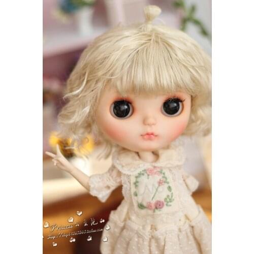 Blythes doll is made from a fake hair wig suited for a 1/6 hair wig with small chirp wavy curls and a long hair mohair with gold