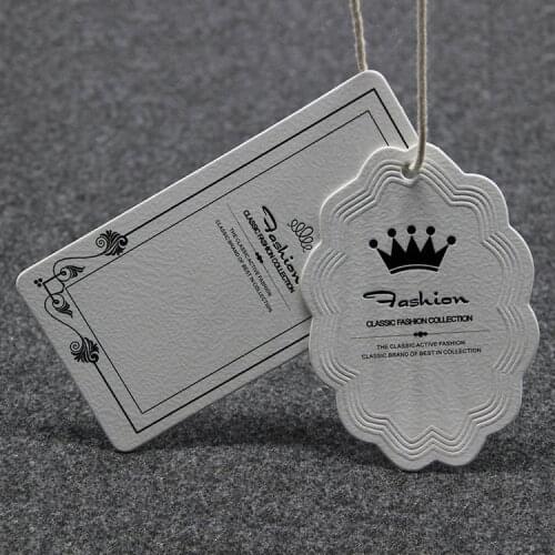 New fashion customized high quality 600gsm white paper embressed tags, OEM high-grade garment labels tags
