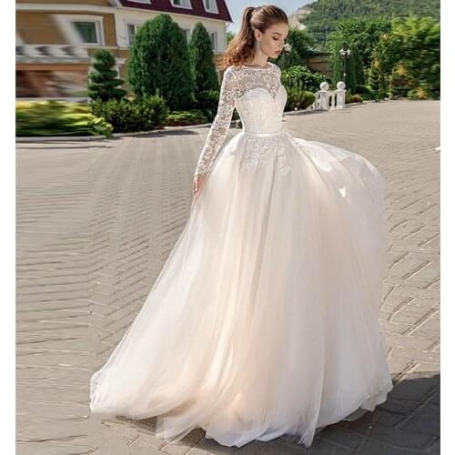 2019 Long Sleeve Bridal Dress Illusion Bateau Lace Sweetheart Neckline Romantic A line Wedding Dress Backless Sweep Train