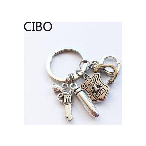 2019 New 1 handcuffs, police badge, bullets, keychain, Lovely POLICE Pendant Charm Keychain