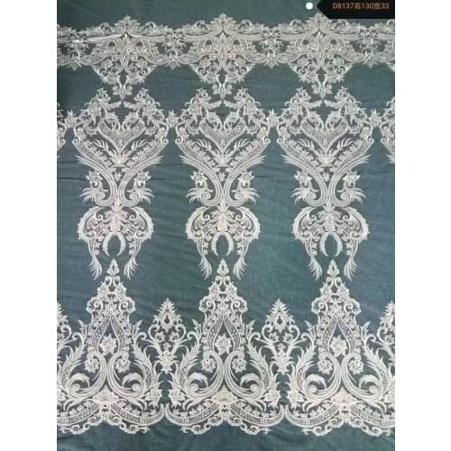 Hot sale low price ivory sequins embroidery lace fabric for wedding party dress