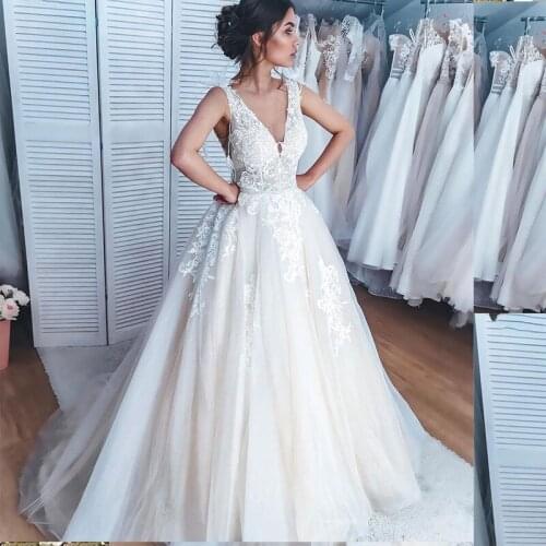 Gorgeous Wedding Dress 2021 V-Neck Sleeveless Lace Appliques A-Line Backless Bridal Gowns Court Train Wedding Dresses