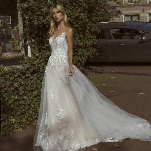 Charming Lace Wedding Dresses 2021 Sheer Neck Sleeveless Custom Made Illusion A-Line Bridal Gowns Robe Mariage