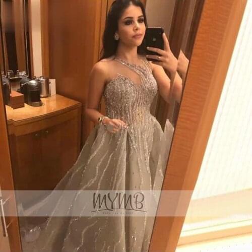 Breathbreaking Dubai Stylish Prom Party Gowns Silver Beaded Illusion Aline Sleeveness Evening Ball Gowns For Women Plus Size