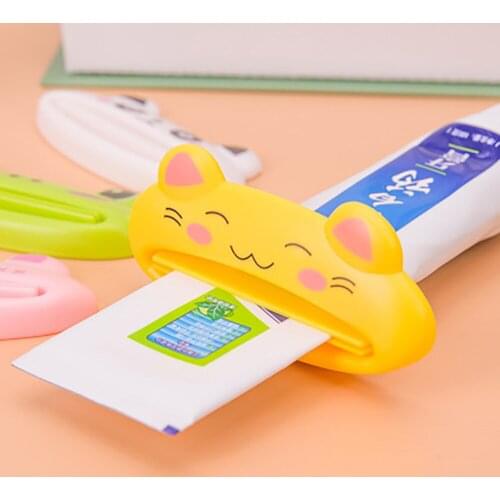 HOT Plastic CartoonTube Rolling Holder Squeezer Toothpaste Dispenser Easy Use Press Squeezing Tool Home Bathroom Accessories