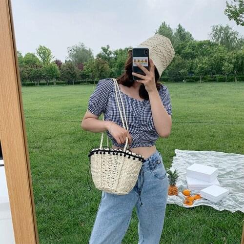 Women Woven Straw Shoulder Bag Basket with Pom Pom Tassel Lace Trim Drawstring Closure Long Strap Vintage Beach Vacation Travel