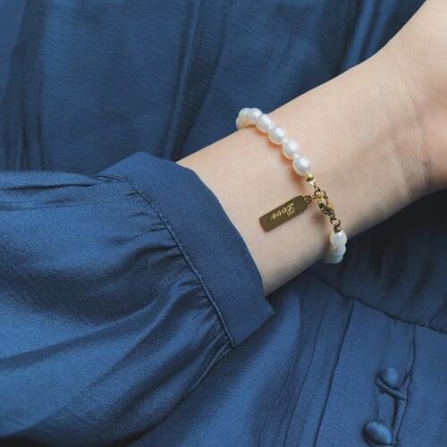 Wild bucket pearl rice fresh water pearl LOVE square pendant titanium steel gold-plated color preservation gift birthday