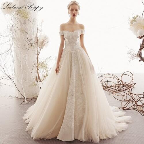 Lceland Poppy Elegant A-line Boat Neck Lace Wedding Dresses 2021 Short Sleeves Floor Length Tulle Bridal Gowns