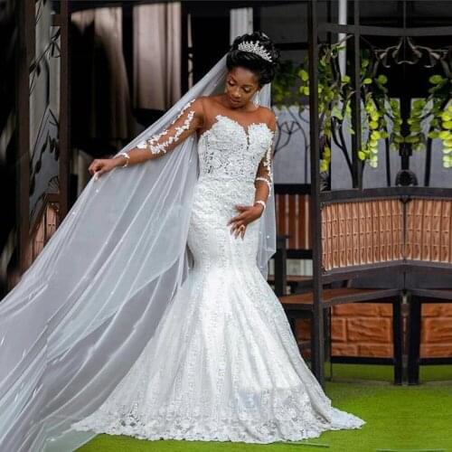Arabic Dubai African Mermaid Long Sleeves Lace Appliques Beaded Bridal Gown Nude Tulle Sweep Train White Weeding Dresses 2021
