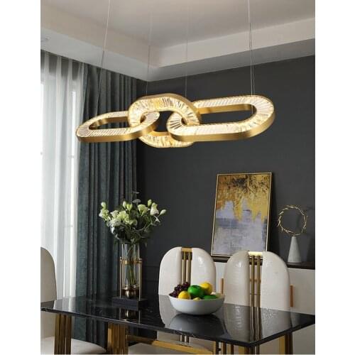 Modern light luxury restaurant atmosphere golden stainless steel crystal lamp creative interlocking hotel long bar chandelier