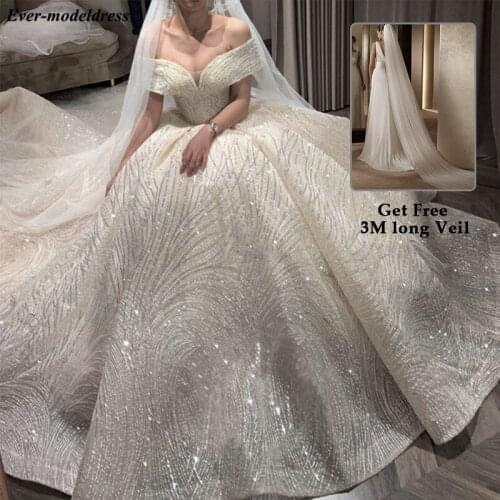 Luxury Wedding Dresses 2021 Off Shoulder African Sparkly V-Neck Lace Up Back Ball Gown Court Train Bridal Robe Do Mariee