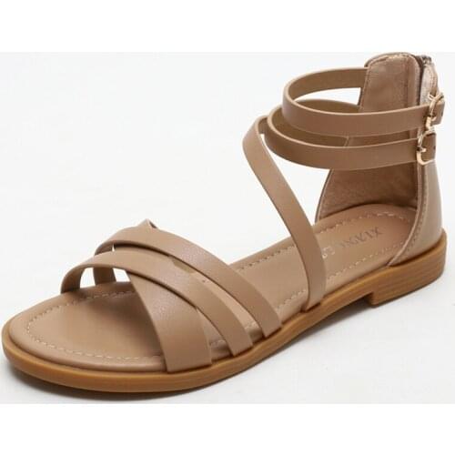 The new summer style of sandals for women is a simple beach vacation Roman shoes with simple flat and thin belt fairy style