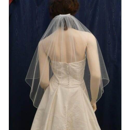 Pencil Edge Rhinestones Add A Wonderful Glitter To This Elbow Length Angel Cut Bridal Veil