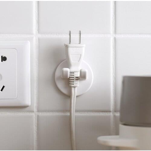 China factory sales self adhesive Plug hook plastic mounted hanging Non-trace paste type power socket holder hooks