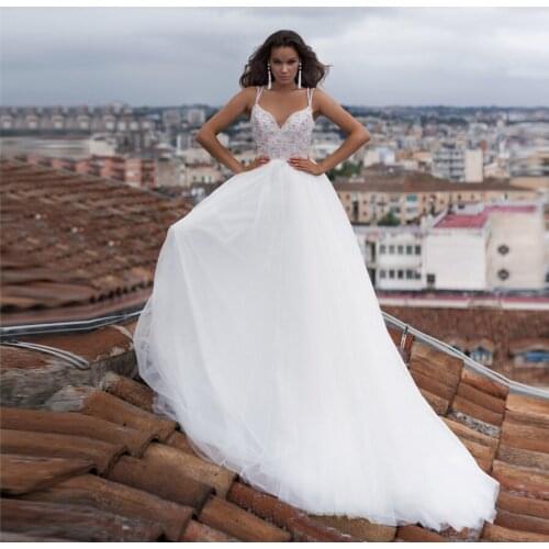 2020 Sexy Spaghetti Straps Pearls Beading Beach Wedding Dress Tulle Sweep Train Wedding Gowns vestido de noiva