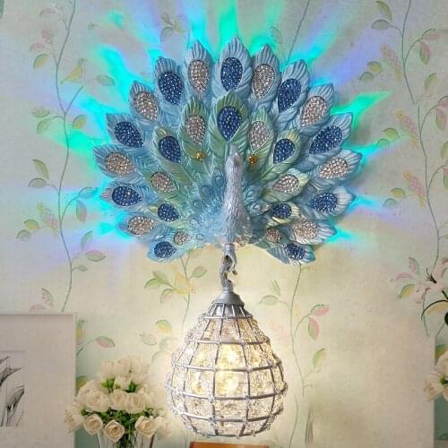 Modern Luxury Southeast Asia Colorful K9 Crystal Metal Bird Nest Lampshade Resin Peacock LED Wall Lamp for Background Aisle