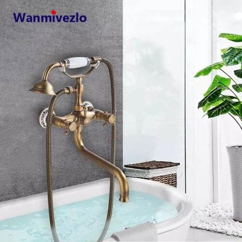 Antique Brass Bathtub Shower Faucets Set Dual Knobs Mixer Tap Wall Mounted Bath Shower Set Swivel Tub Long Spout Bath Shower