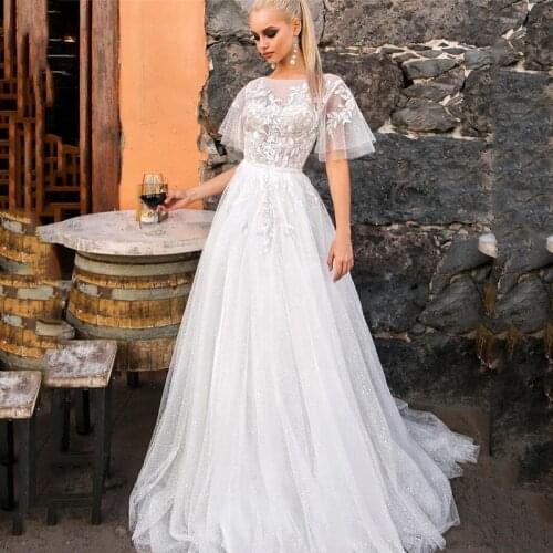Eightree Elegant Lace Shiny Beach Wedding Dresses 2021 Cap Sleeve Vintage Bride Dress Applique Backless Wedding Gowns Castle