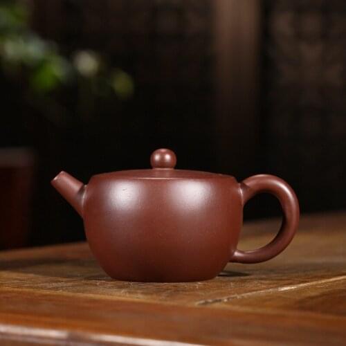 Purple clay pot craftsman Wang Fang handcrafted a new kind of original mine purple clay jacket cup pot Kungfu tea set
