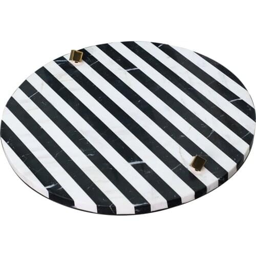 Black and white striped marble round tray decorated with wine utensils tray