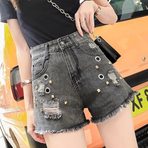 MUMUZI high fashion denim shorts female summer 2020 Korean version new rivet hole tassel wide leg shorts high waist hot shorts