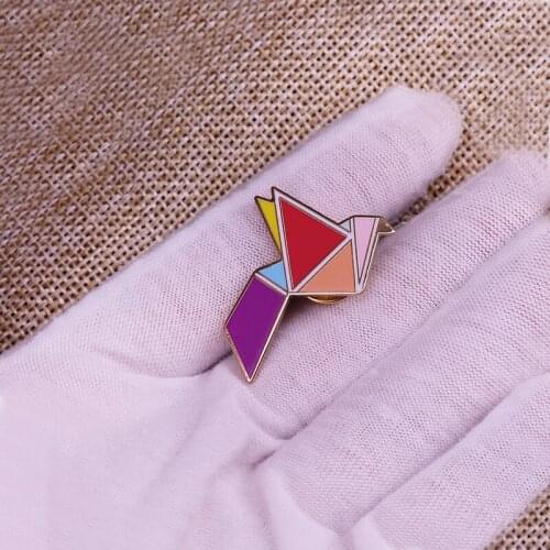 This Precious Little Origami Bird Badge Will Bring a Neon Bright Touch of Geometric Heaven to Your Winter Jacket