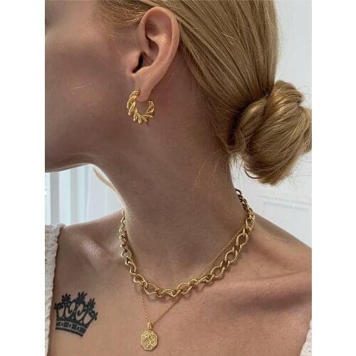 INS European and American simple high-end net red gold small circle hollow horn earrings 2020 new trendy personality temperament