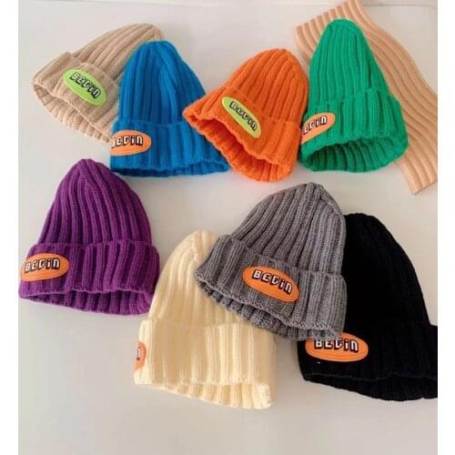 Korea 21 autumn/winter new style candy color personalized leather label children hooded hat for boys and girls baby knitted hat
