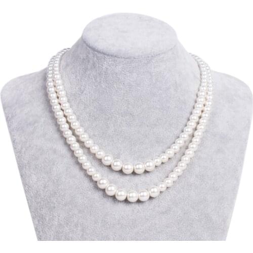 The pristine 1940 glass pearl necklace, the vintage wedding of two ivory bridal necklaces, the 1920 art style of gatsby jewelry