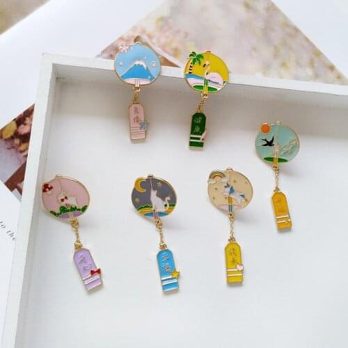 Cute cartoon fashion metal wind chime bell brooch with good wishes in Chinese words as a gift
