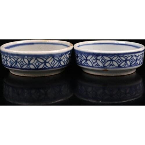 A pair of old Chinese porcelain cups with blue and white shoutao pattern