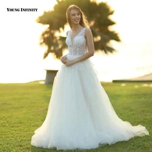 Hot Sale A Line Wedding Dresses 2021 Sleeveless Bridal Gown Lack Up Back V Neck Court Train Beaded White Plus Size Bride