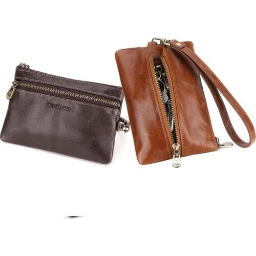 Dual-purpose leather key case with wrist strap, multi-function hand holding trendy key case