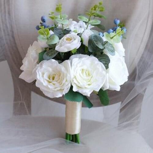 Bride holding flowers white rose ball simulation bouquet knot wedding