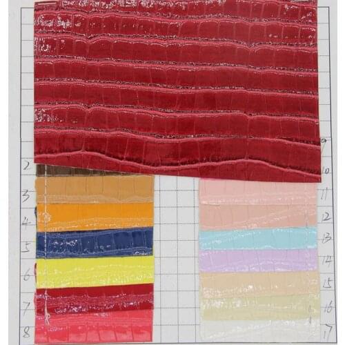 Low-cost supply Factory bright surface crocodiles grain PU leather fabric material wholesale