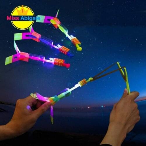 10PCS Outdoor Shining Rocket Flash LED Light Night Kids Luminous Slingshot Toys Shine Slingshot Elastic Helicopter Rotating Toy