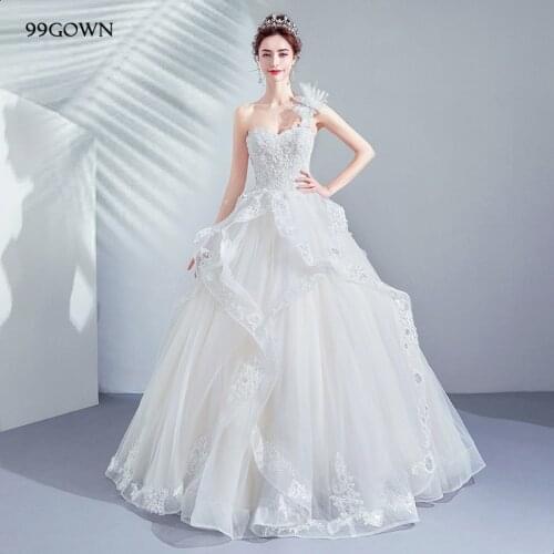 99GOWN High Fashion 2021 Women Wedding Dress Sexy One Shoulder A-Line Wedding Ball Gown Handmade Flower Embroidery Bridal Dress