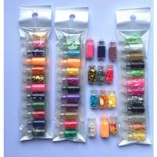 12 count set of glass fairy bottles with plastic cork filled with mixed glitter, pearls, beads, confett for UV gel nail Sticker