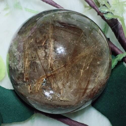 Golden rutilated sphere