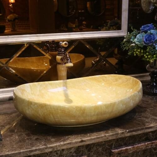 Artistic porcelain ceramic wash basin bathroom sink wash basin bowl oval shape Imitation marble bathroom sinks countertops