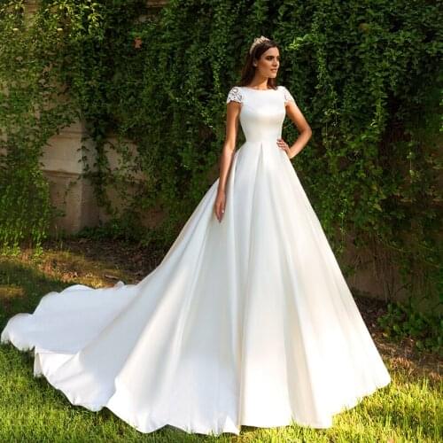 Fashion Simple Elegant A Line Satin Wedding Gowns With Pockets 3D Flowers Cap Sleeves Vintage Bridal Dress 2021