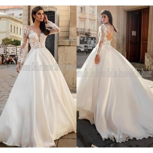 2021 New Elegant V-Neck Sheer Long Sleeves Custom Made Lace Applique Pearl Beaded Open Back Satin A-Line Wedding Dress Robe De