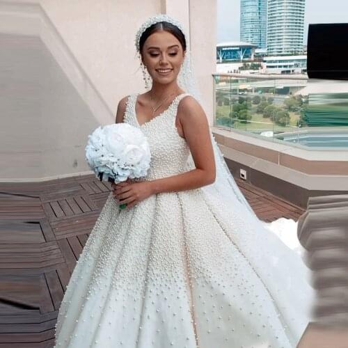 2021 Celebrity Wedding Dresses In Dubai Pearls V Neck Ball Gown Luxury Bridal Wedding Gowns With Long Train Plus Size
