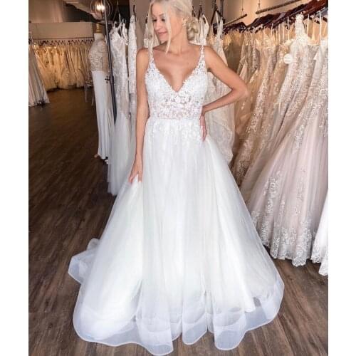 Wedding Dress A-Line V-Neck Spaghetti Straps Sleeveless Lace Appliques Backless Floor Length Sweep Train Elegant Bride Gown 2021