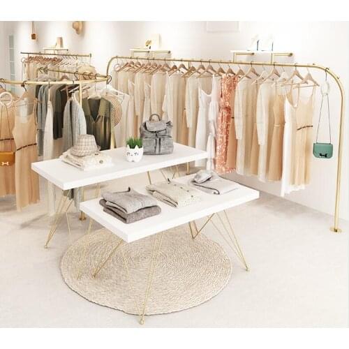 Clothing store display table in the middle of the island running water store set of solid wood rectangular high and low table