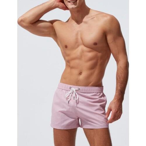 2021 New Mens Boxer Swim Trunks Beach Surfing Sports Shorts European American Casual Fashion Low Waisted Solid Color Shorts