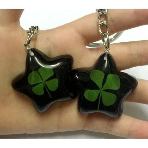 FREE SHIPPING 4 pcs real four leaf clover fashionable black star style keychain