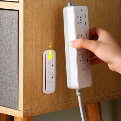 Wall-mounted punch-free plug holder socket strip storage router rack free punching wall-mounted power strip Holder