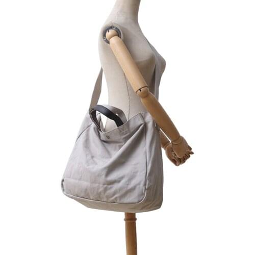 2021 new Japanese shoulder bag literary messenger bag leisure beach bag female canvas bag solid color portable mens bag